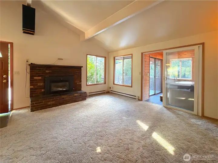 Living Room with gas fireplace - hardwoods under carpet!!