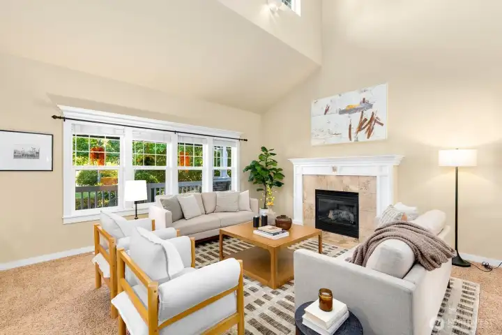Formal living room w/ vaulted ceilings & fireplace