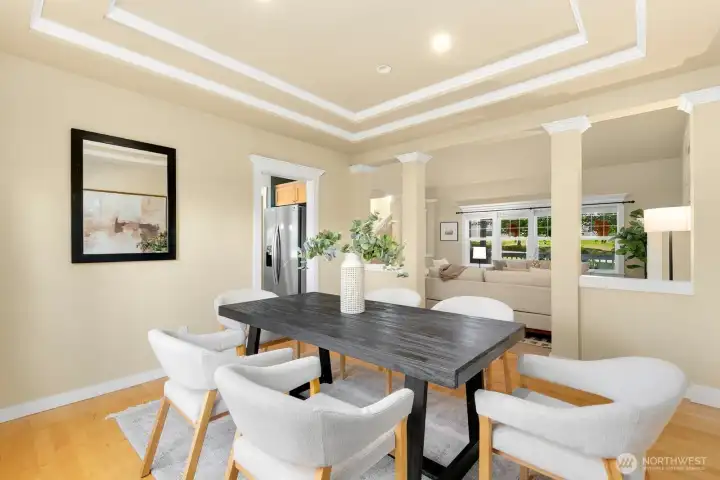 Formal dining room gazing out onto fully fenced yard, just shy of an acre