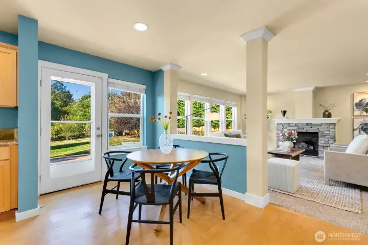 Open kitchen/ casual dining + den w/ fireplace