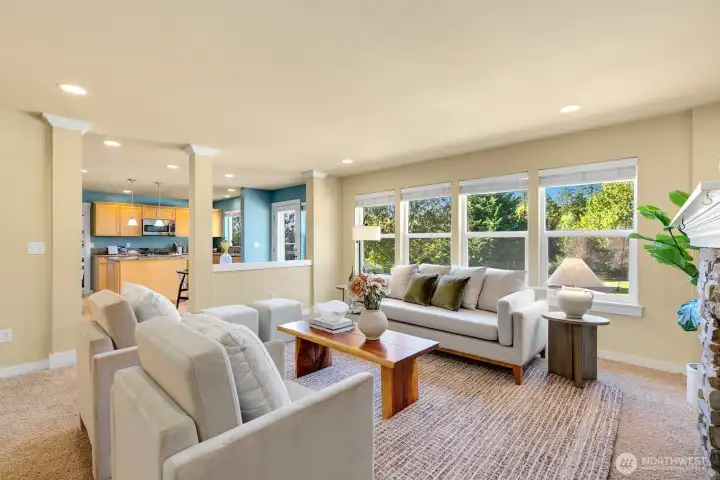 Open kitchen/ casual dining + den w/ fireplace