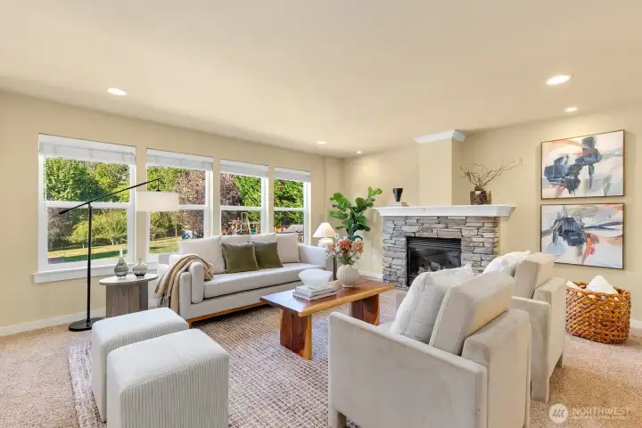Open kitchen/ casual dining + den w/ fireplace