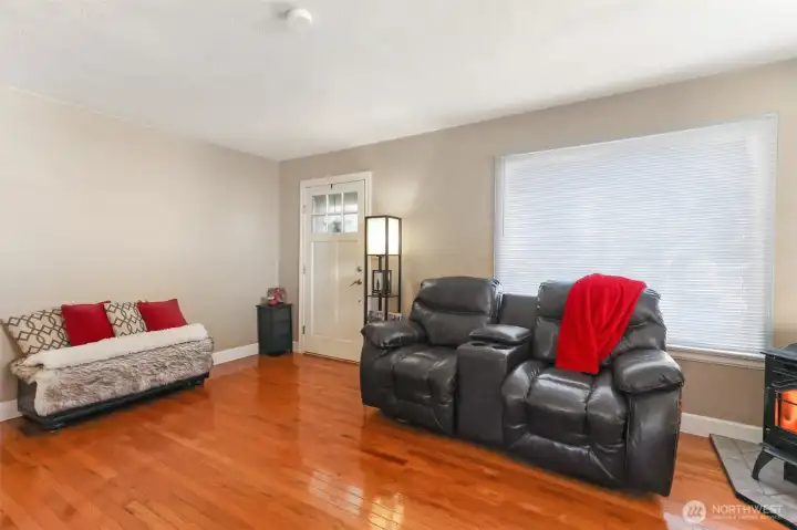 View of entry and living from dining area