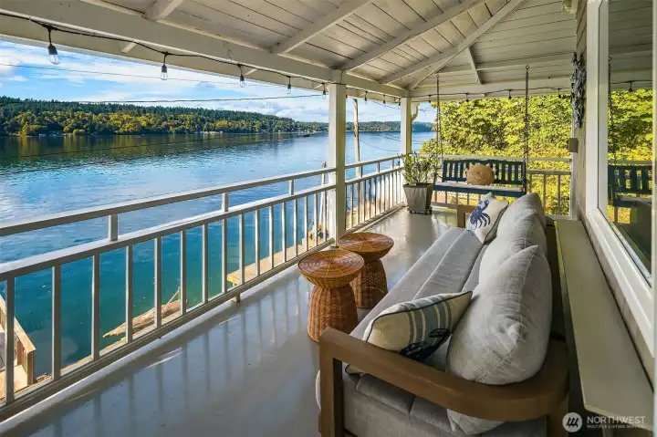 French doors lead to this inviting wrap around covered deck, perfect for relaxing year-round. This deck has been resurfaced with new plywood and a waterproof barrier.