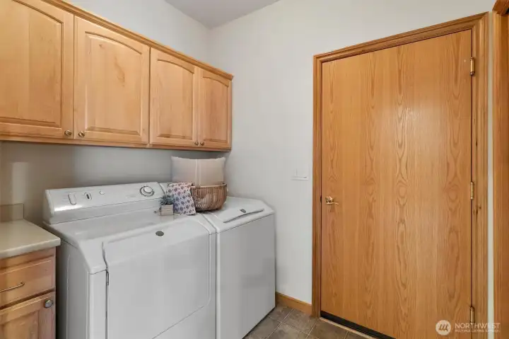 Laundry room with storage.