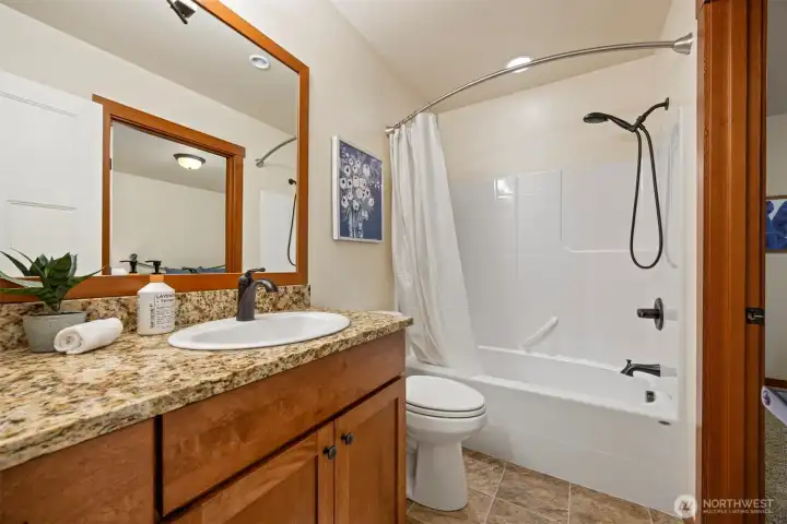 Second full bathroom, which doubles as the guest bath and ensuite for the second bedroom.