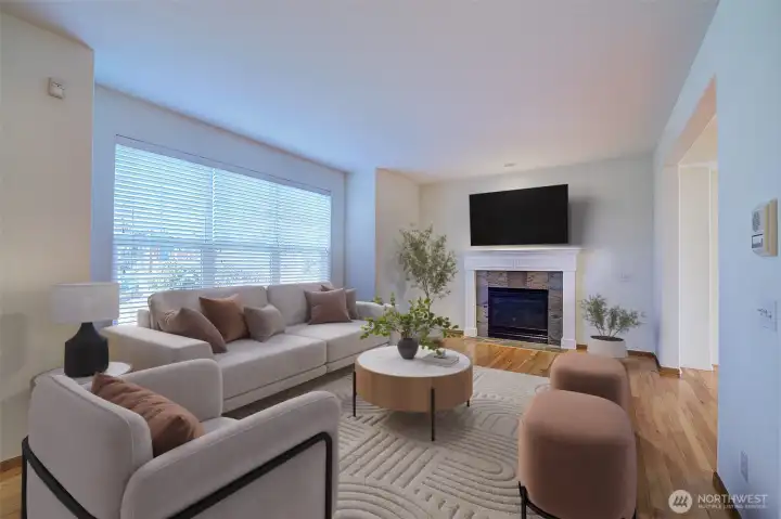 Cathedral ceilings in large living room surrounding gas fireplace