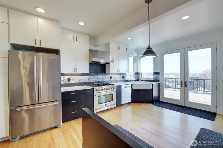 Kitchen nicely connected to huge deck, great for enjoying the scenary