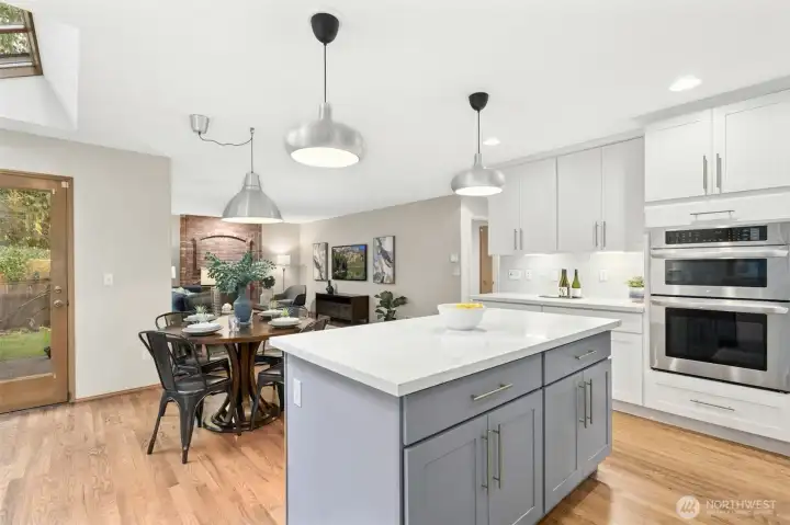 Another angle showing the ovens and additional cabinetry and counters.