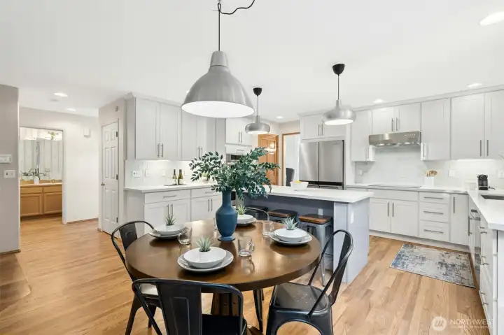 Another angle showing the nook space and good sized pantry door next to ovens.