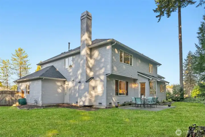 Large side yard showing the door leading into the garage.