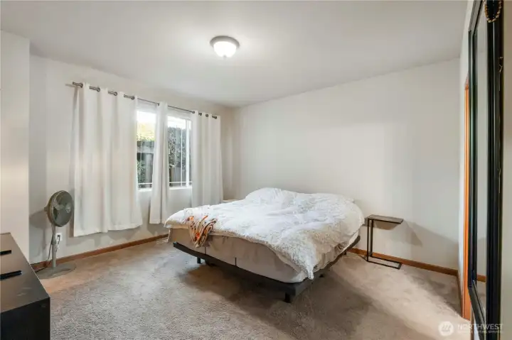 Primary Bedroom. Nice large room. You'll see you can fit a King size bed and plenty of other furniture. Window looks out to private patio.