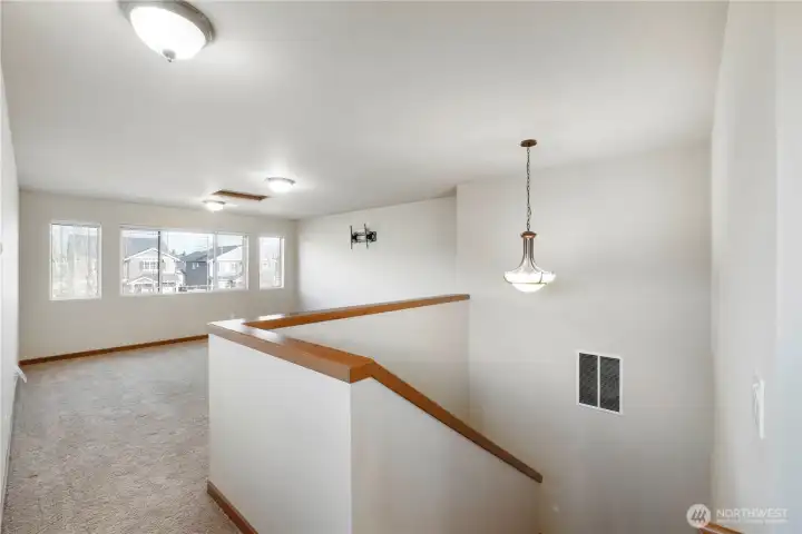 Upstairs entertainment room. Plenty of room for a fun space to entertain. Seller used to have an air hockey game here.