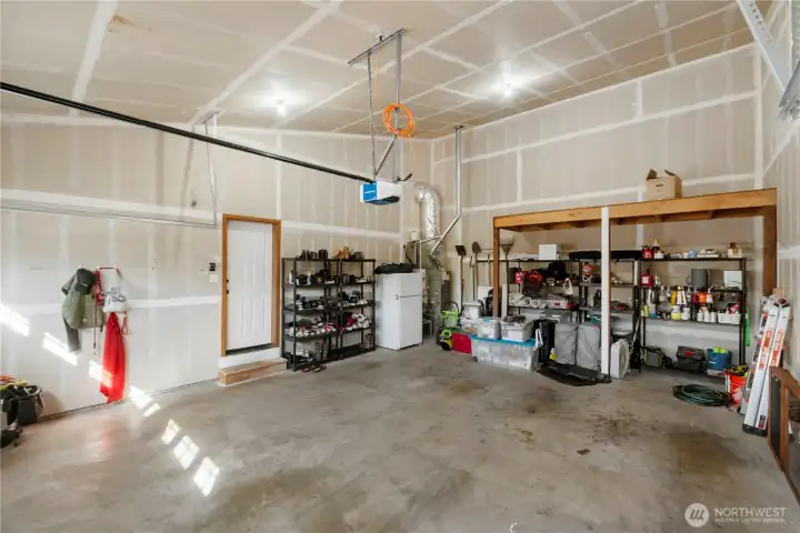 Large 2 car garage. And still plenty of other storage room. Freezer stays with the house.