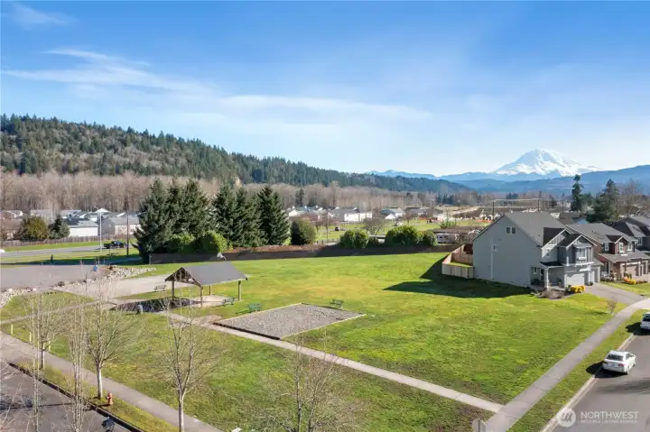 One of the 3 parks in the neighborhood community. Just a couple doors down from your new home. And look at that view of the mountain.