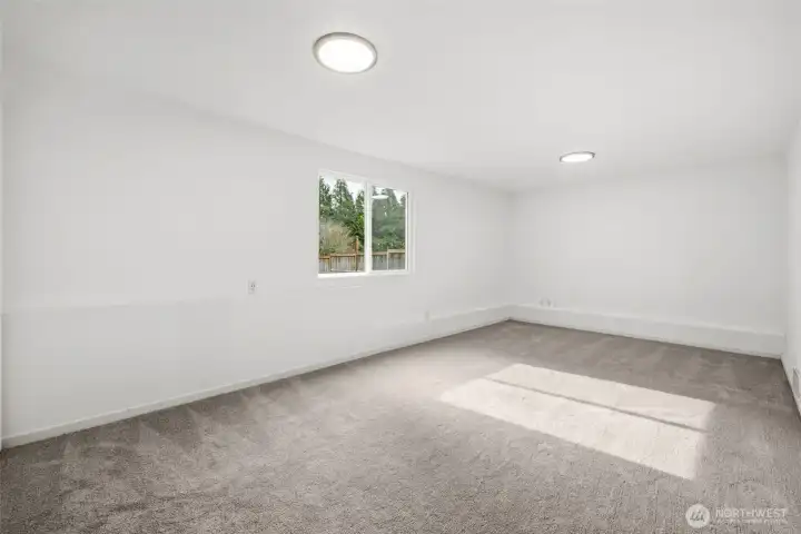 A flexible lower-level space ready for movie nights, game days, or whatever fits your lifestyle.