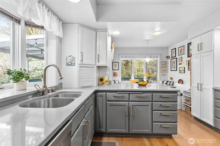 Kitchen is light and bright with a window looking out to your private deck and a breakfast nook that looks out to the creek.