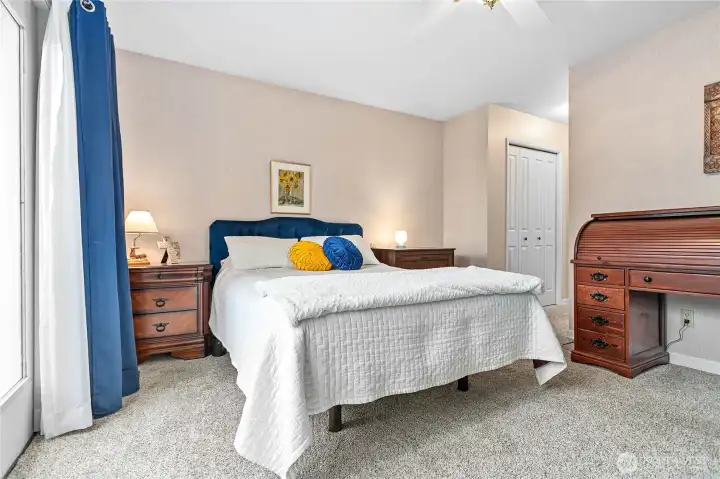 Private primary bedroom and ensuite look out to the creek and nature