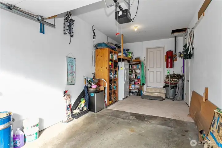 Garage is a two car garage that had a wall built to make half of it into a wood working shop.  Wall can be removed upon request.