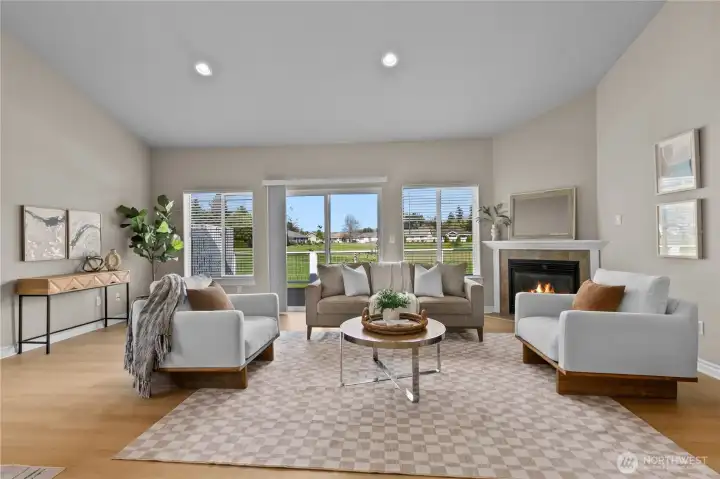Open living area with comfortable seating layout and easy access to outdoor deck