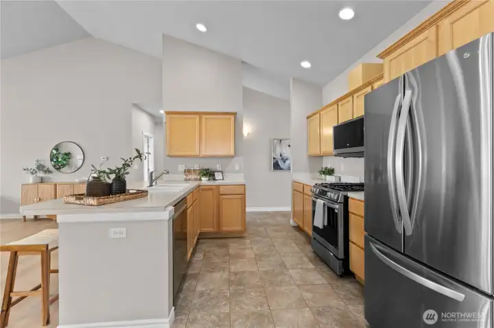 Kitchen with ample cabinetry, counter space, and stainless steel appliances
