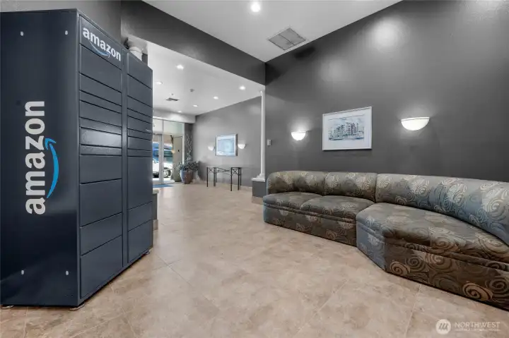 Wonderful secure lobby entrance with seating area and secure Amazon pickup/drop off containers and mail room