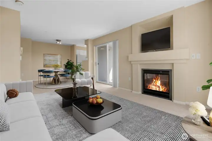 Living area looking back to dining area and kitchen. Also has gas fireplace (HOA paid). Virtually staged