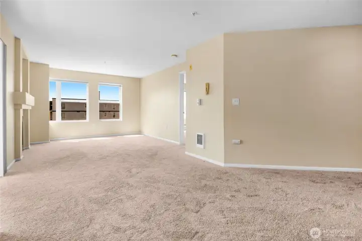 Both living and dining area with lots of natural light in this corner unit