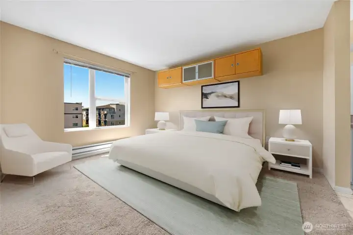 Primary bedroom with tons of natural light and views of City and beyond! Virtually staged