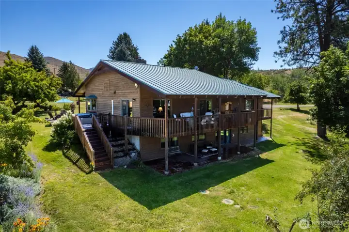 Back of house, covered redwood deck, mountain and river views