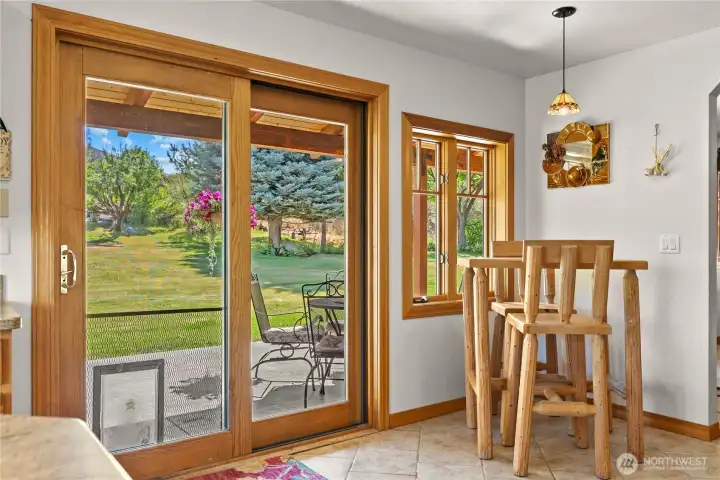 Kitchen view, breakfast nook with a courtyard view