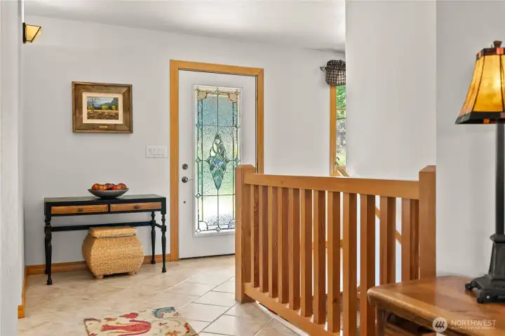 Entry on upper level and stairs to lower level