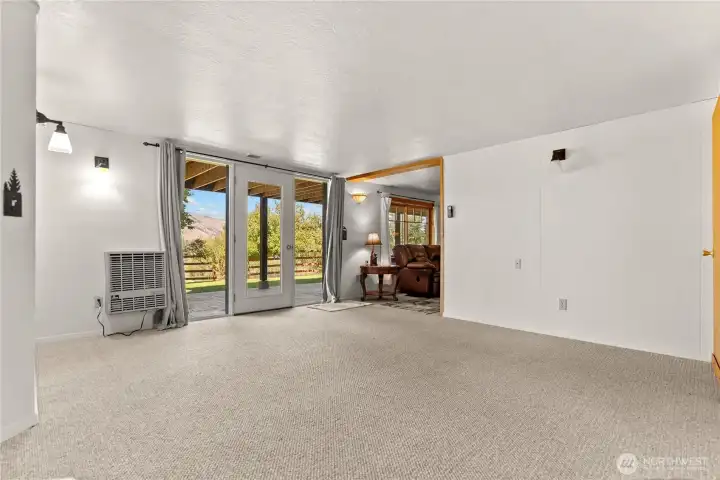 Lower level sitting area and access with patio area and private sitting area