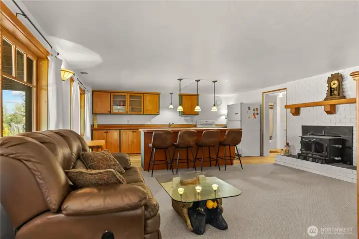 Lower level living room, fire place, and second kitchen area. Optional private Rental with private access and separation