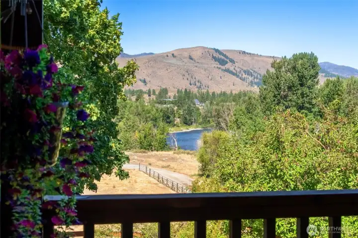 Stunning river and mountain views off the covered deck over looking the riding arena