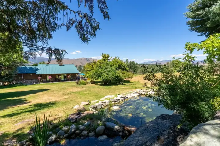 Pond with waterfall and setting areas to enjoy the views and relax