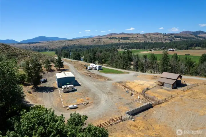 25.56 acres, large shop, barn with tack room, arena, and  additional single-wide manufactured home—perfect for guests or rental income