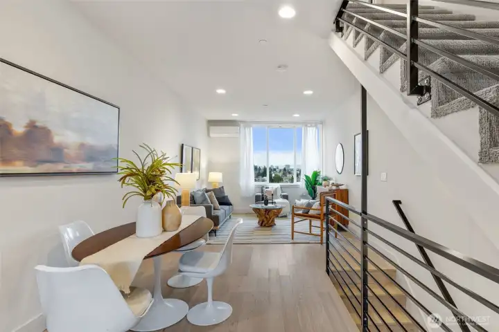 Dining room space! High ceilings distort the photo; excellent natural light.