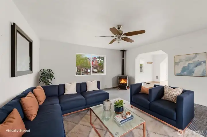 Virtually staged Living room with pellet stove.