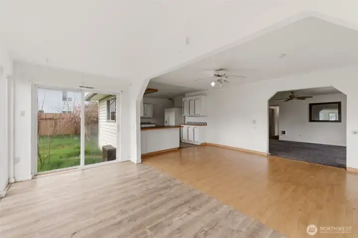 View from sunroom into kitchen and living room.