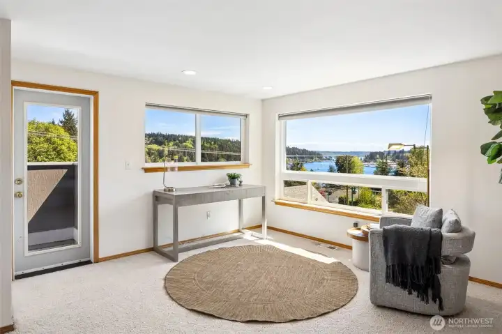 The primary bedroom features its own view deck and sweeping harbor views.