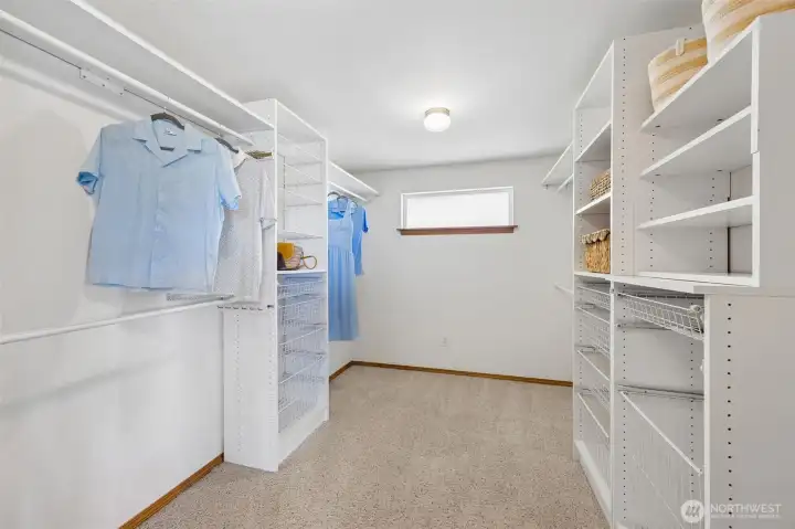 Spacious primary closet.