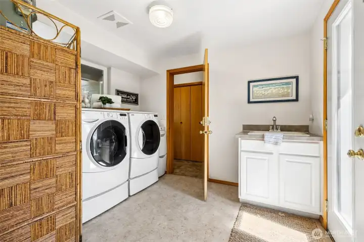 Past the kitchen, the utility room separates the main house from the ADU.