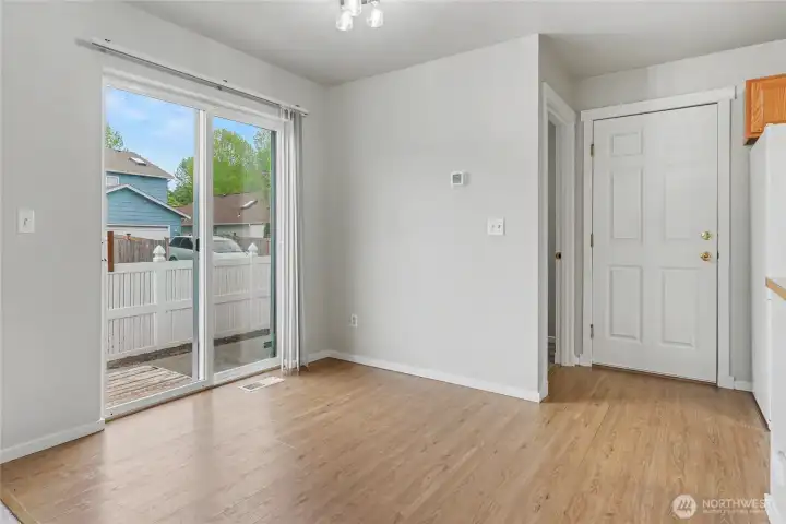 Dining nook with laundry room behind.