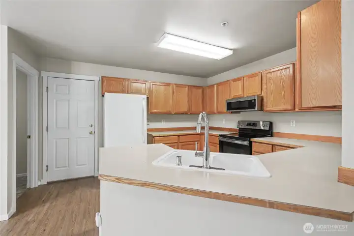 Lots of cabinets and storage in the kitchen.