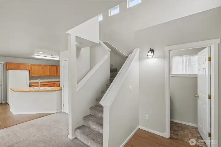 Vinyl plank flooring in kitchen and entry/powder bath.