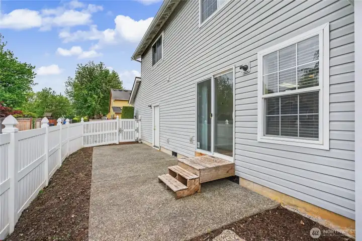 Side yard - low maintenance. With garage access.