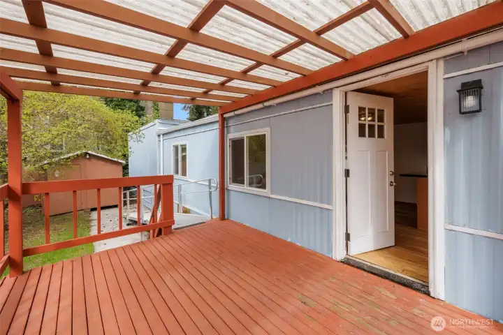 Generous covered deck with room to spread out, rain or shine.