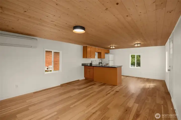 A generously sized living room with a ductless mini split for those warm summer days