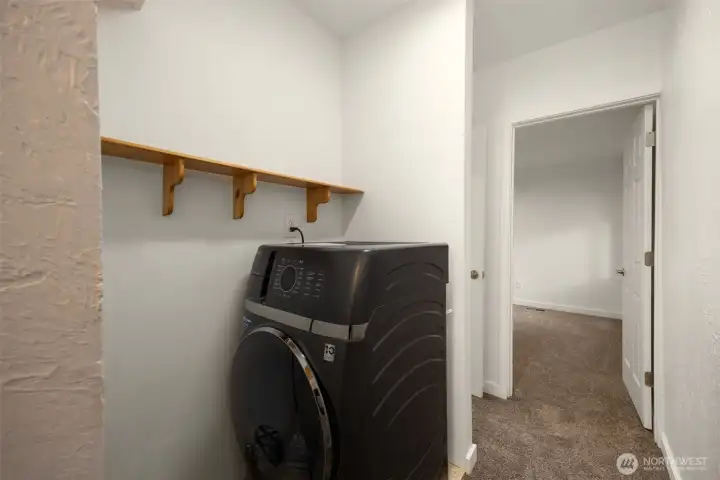 Convenient combo washer/dryer unit with storage shelf above, and a dryer hookup ready if you want to add a standalone dryer down the road.